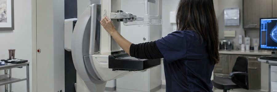 AI generated illustration of a technologist adjusting a mammography machine in an empty imaging suite